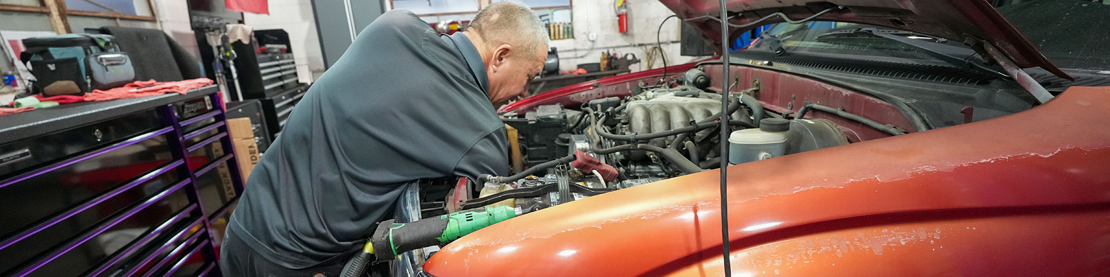 image of ASE certified mechanic working on a vehicle at Masaki's Auto Repair