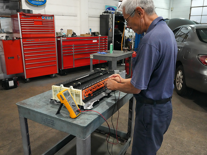 image of dave Masaki testing a hybrid battery cell
